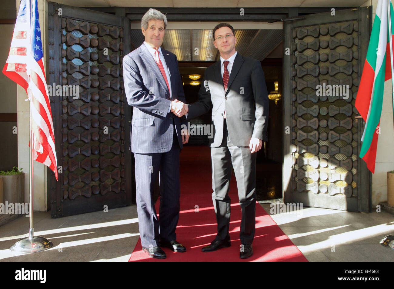 Bulgarian Foreign Minister Daniel Mitov shakes hands with U.S. Secretary of State John Kerry after he arrived at the Ministry of Foreign Affairs in Sofia, Bulgaria, on January 15, 2015, for a one-on-one meeting and a working lunch. Stock Photo