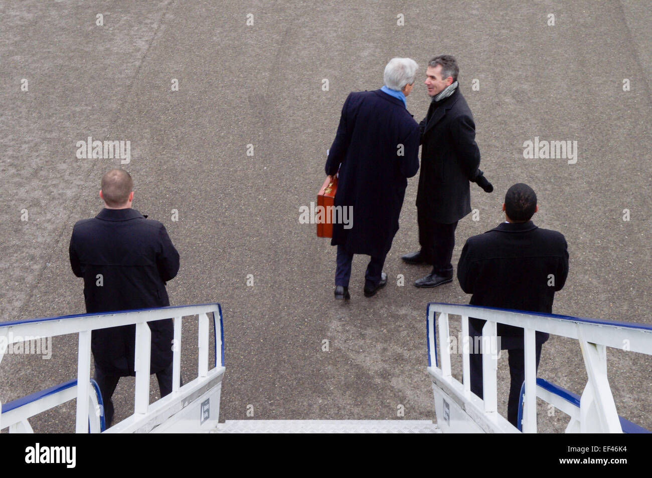 Pascal Bornoz of the Swiss Ministry of Foreign Affairs greets U.S. Secretary of State John Kerry as he arrives in Zurich, Switzerland, on January 23, 2015, to address the World Economic Forum in Davos. Stock Photo