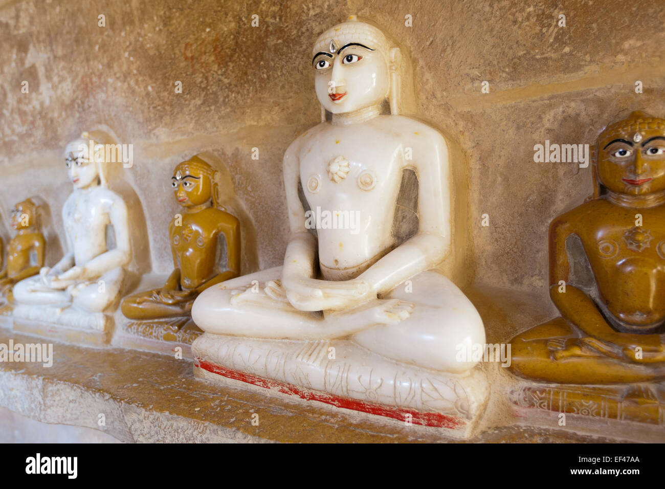 Jaisalmer, Rajasthan, India. Jain Temple, interior shrine, relief sculptures of the last Tirthankara, Mahavira Stock Photo