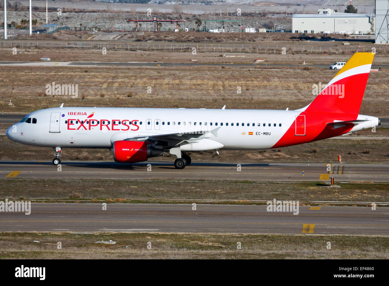 Iberia Express Airbus A320 taxis to stand at Madrid airport. Stock Photo