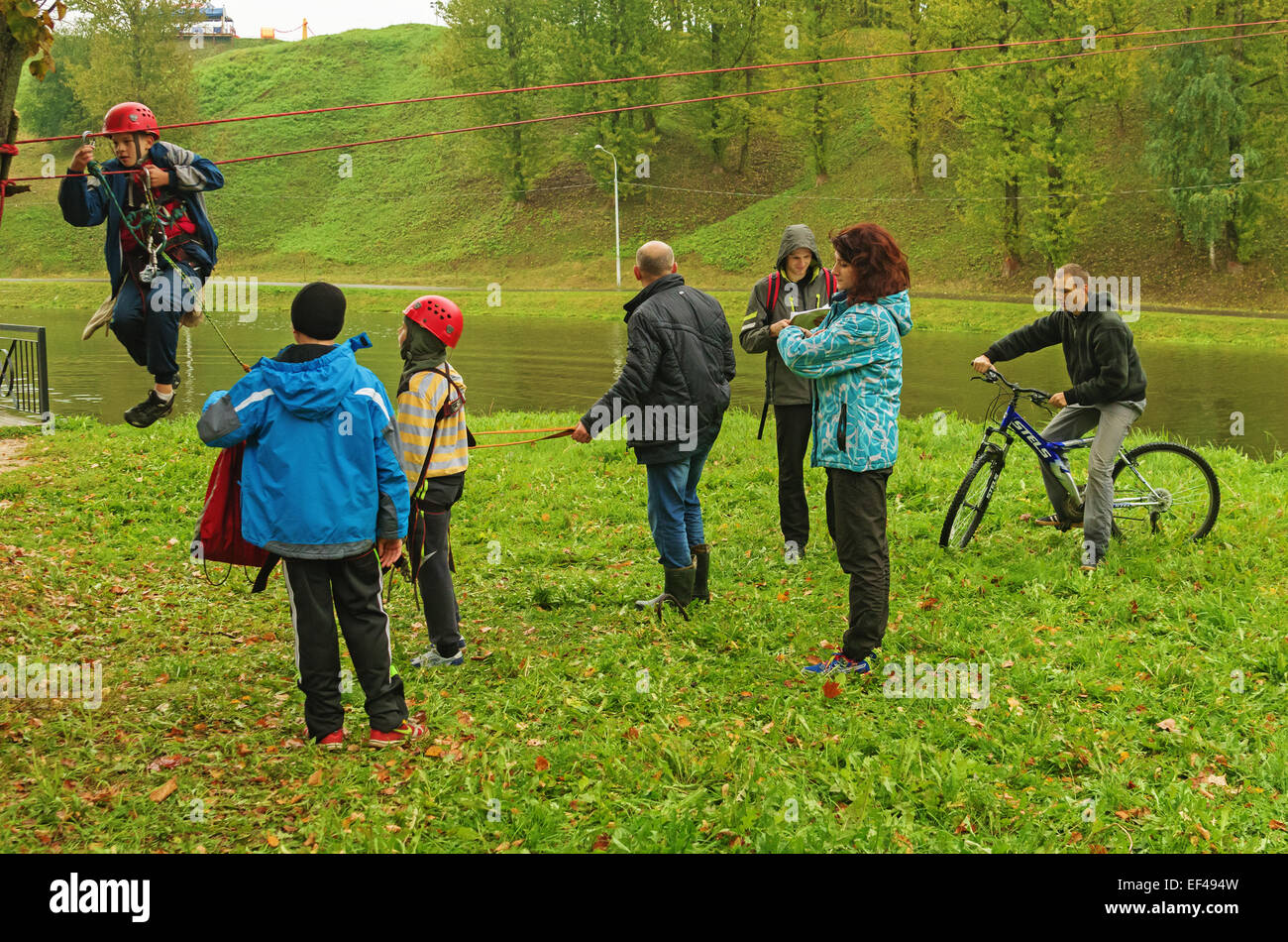 World Tourism Day - sport tourism competition in park on the river Vitba, Vitebsk, inclined crossing on ropes through the river. Stock Photo