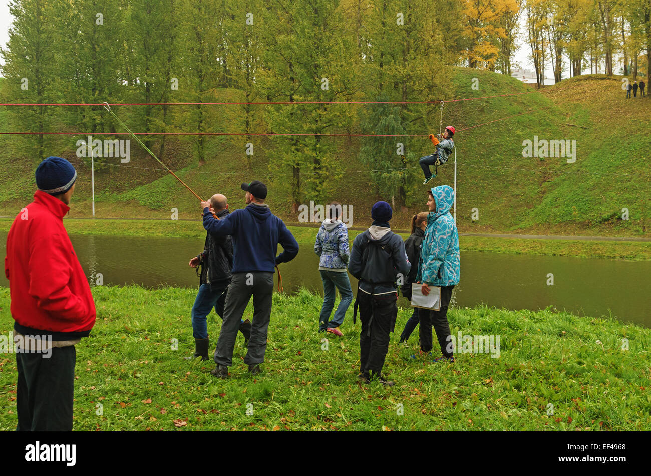 World Tourism Day - sport tourism competition in park on the river Vitba, Vitebsk, inclined crossing on ropes through the river. Stock Photo