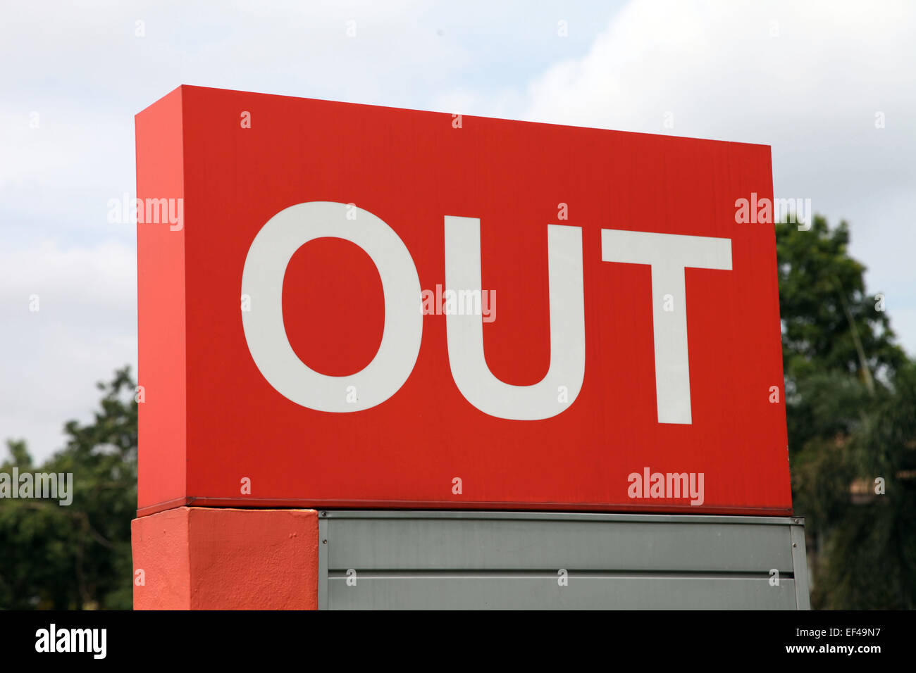 Outdoor Board sign with the Word OUT in capital letter in white color on a red background Stock Photo
