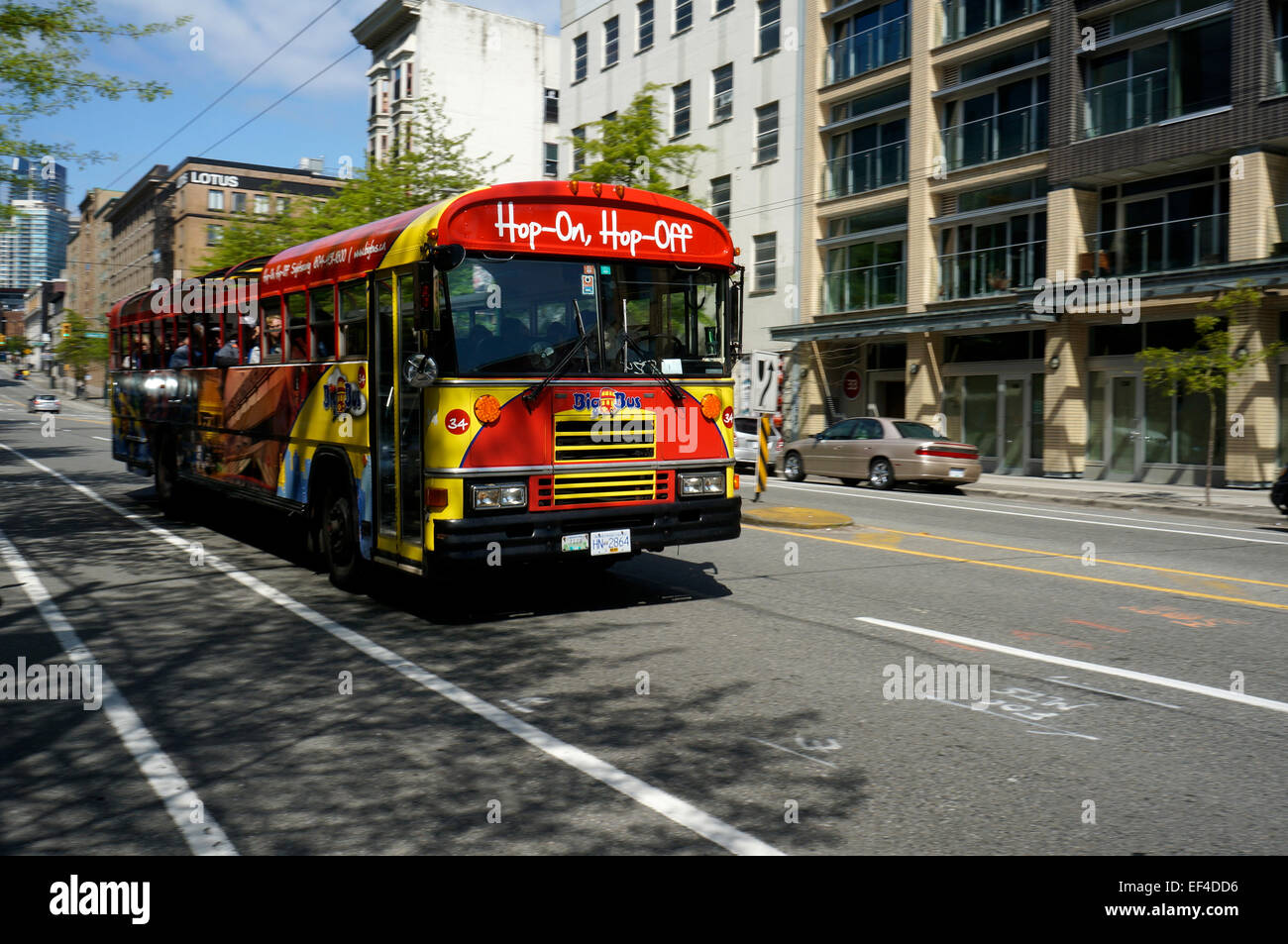 Hop-on, hop-off tour bus on Pender Street, Downtown Eastside, Vancouver, BC, Canada Stock Photo