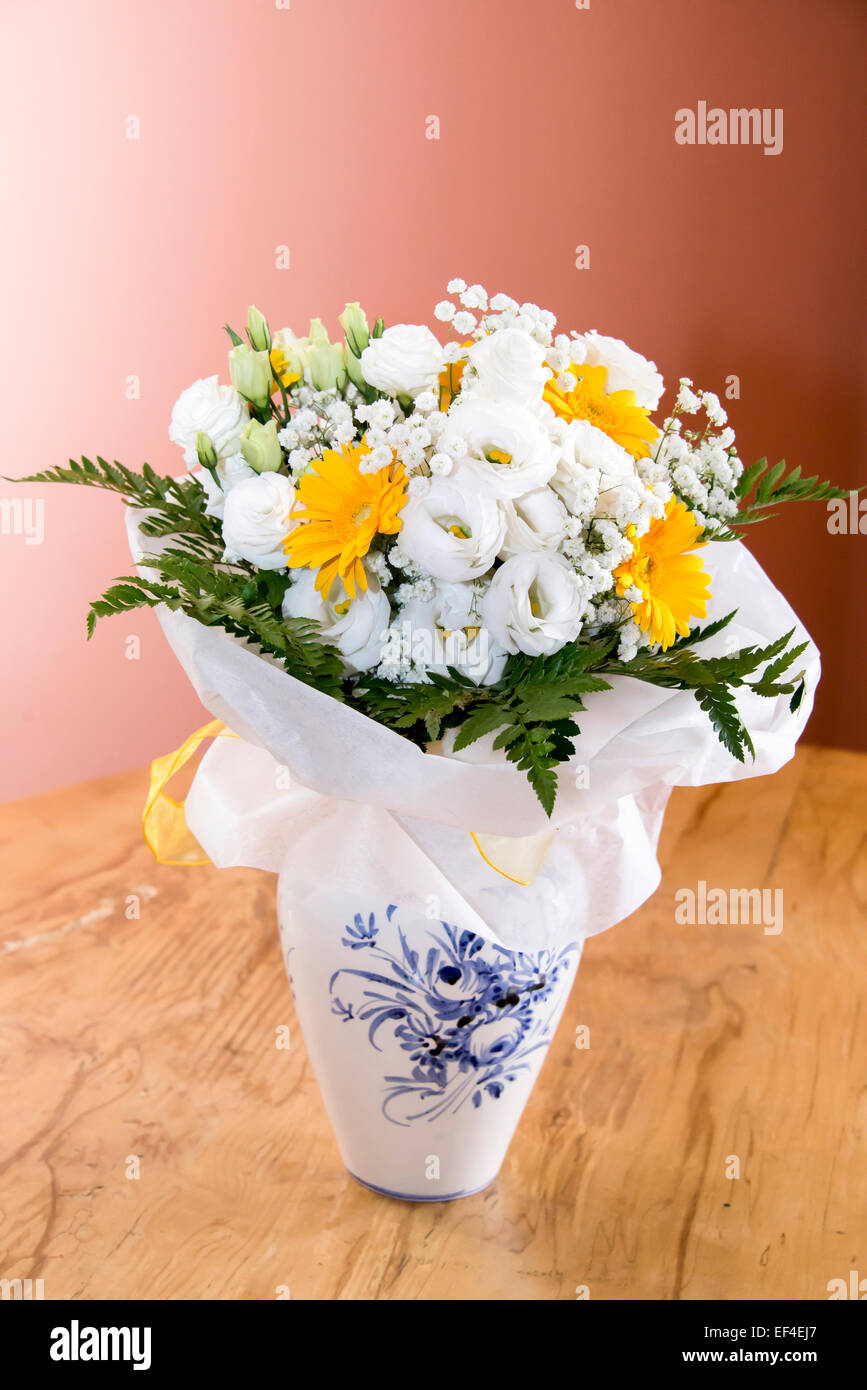 Begonia and gerbera flowers in pot Stock Photo
