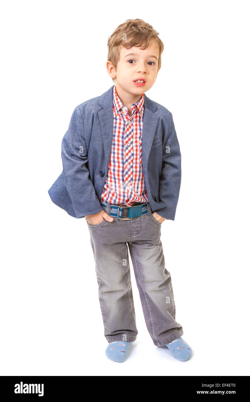 Little boy with his hands in pockets on white background Stock Photo
