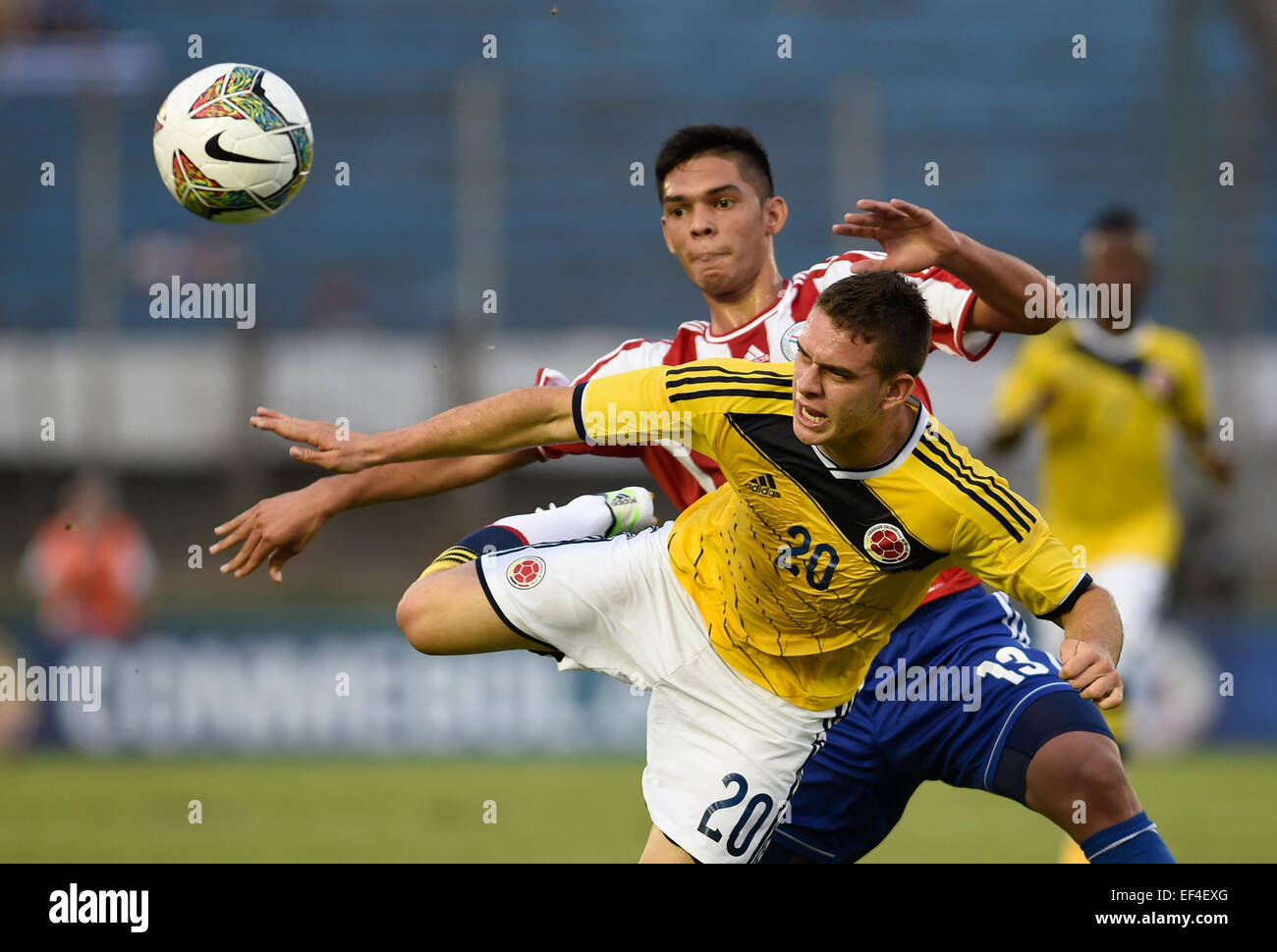 Montevideo, Uruguay. 26th Jan, 2015. Paraguay's Omar Alderete (Rear), vies with Colombia's Rafael Borre in a match of the South American U-20 tournament in the Centenario Stadium, in Montevideo, capital of Uruguay, on Jan. 26, 2015. © Nicolas Celaya/Xinhua/Alamy Live News Stock Photo