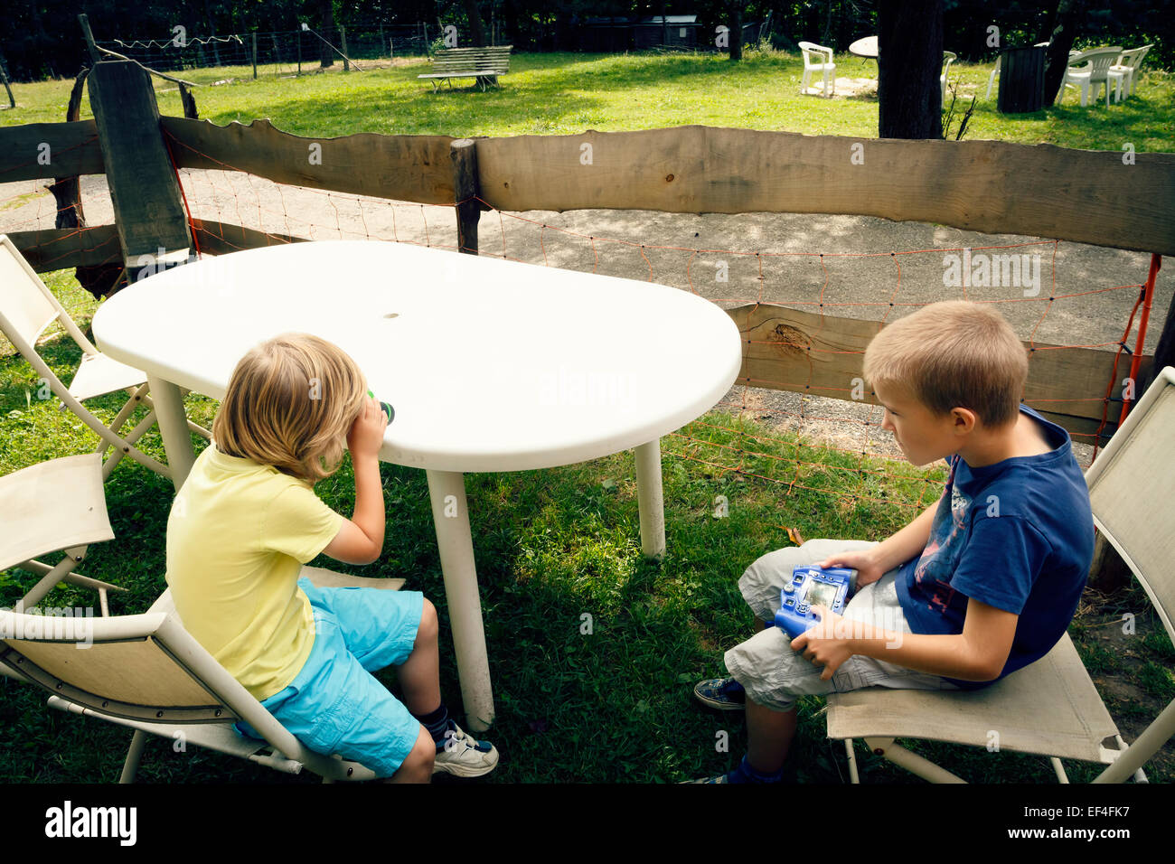 Two young boys outdoors at a park. Stock Photo