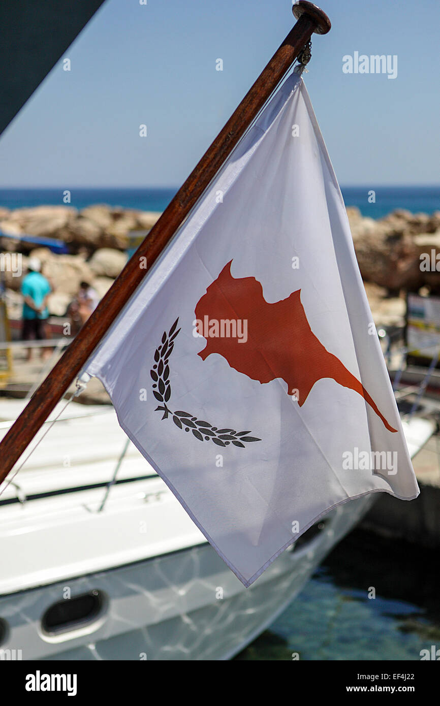 Flag of Cyprus set upon a mast aboard an tourist cruise boat, seen here with a slight breeze blowing the flag. Stock Photo