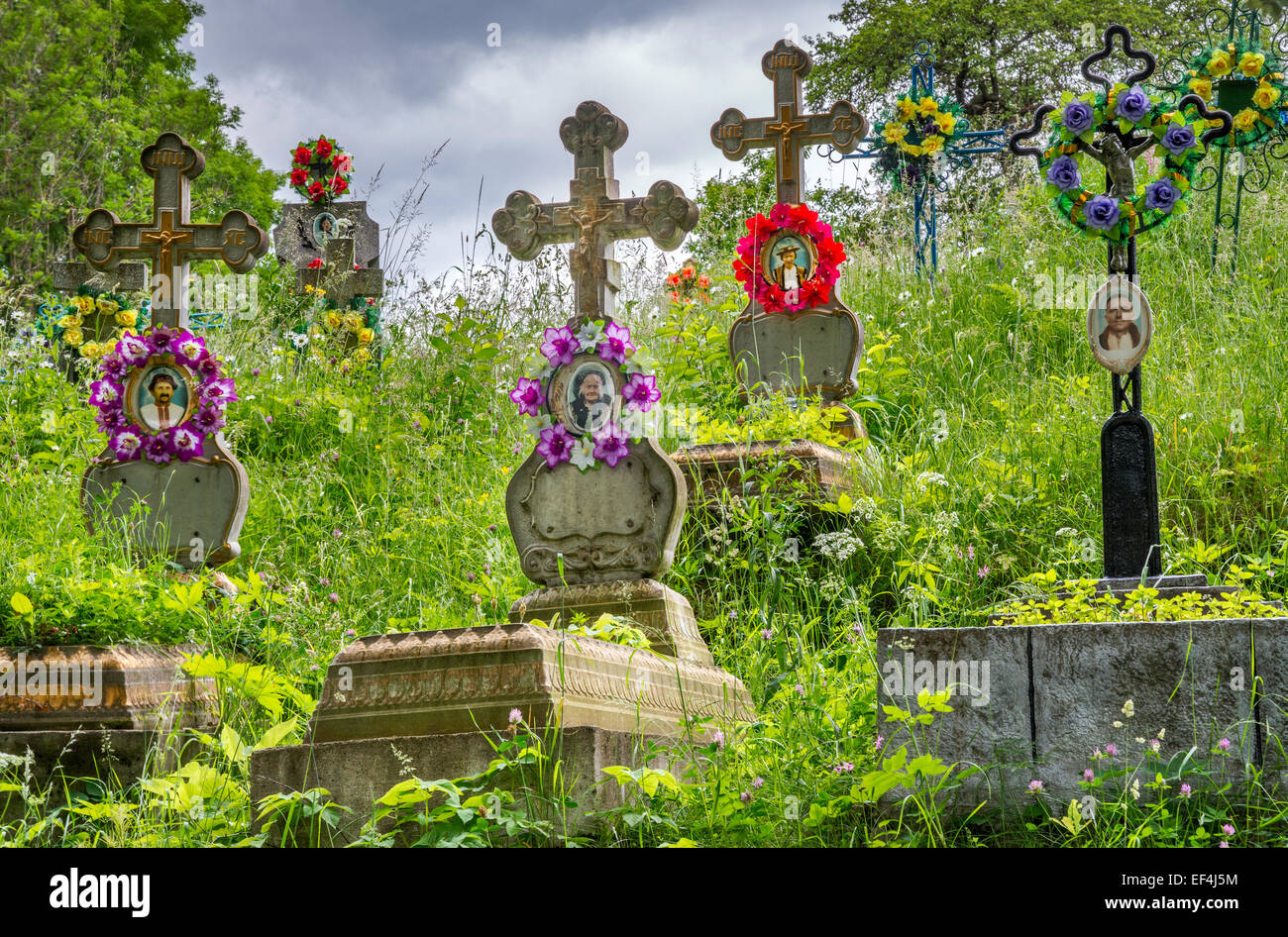 Cemetery at Greek Catholic Church in village of Kryvorivnia, Carpathian Mountains, Hutsul Region, Pokuttya, Ukraine Stock Photo