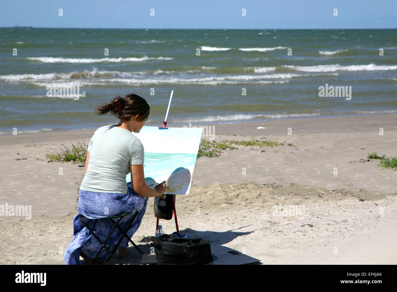 girl painting sea ocean wind Stock Photo