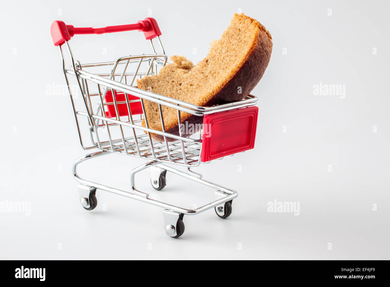 shopping trolley with a piece of black bread Stock Photo