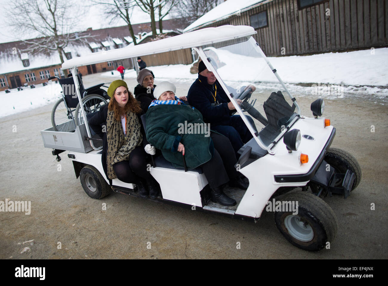 Oswiecim, Poland. 27th Jan, 2015. Survivors are sitting in a golf cart at the former Nazi-German concentration and extermination camp KL Auschwitz I prior to a ceremony marking the 70th anniversary of the liberation of the former Nazi-German concentration and extermination camp KL Auschwitz-Birkenau in Oswiecim, Poland, 27 January 2015. Photo: Rolf Vennenbernd/dpa/Alamy Live News Stock Photo