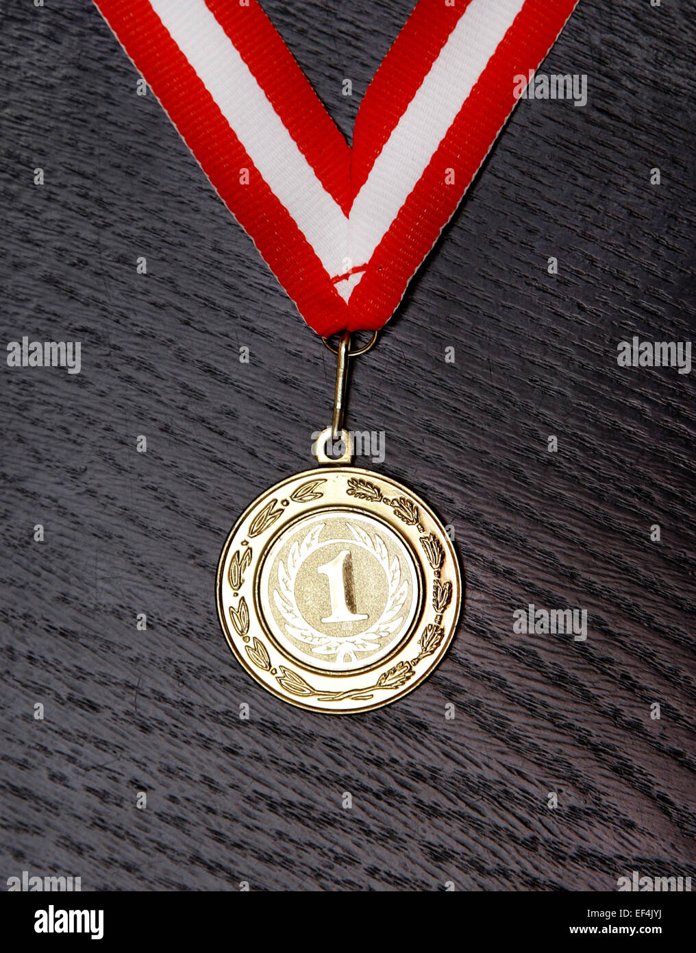 golden medal for first place with red and white ribbon Stock Photo