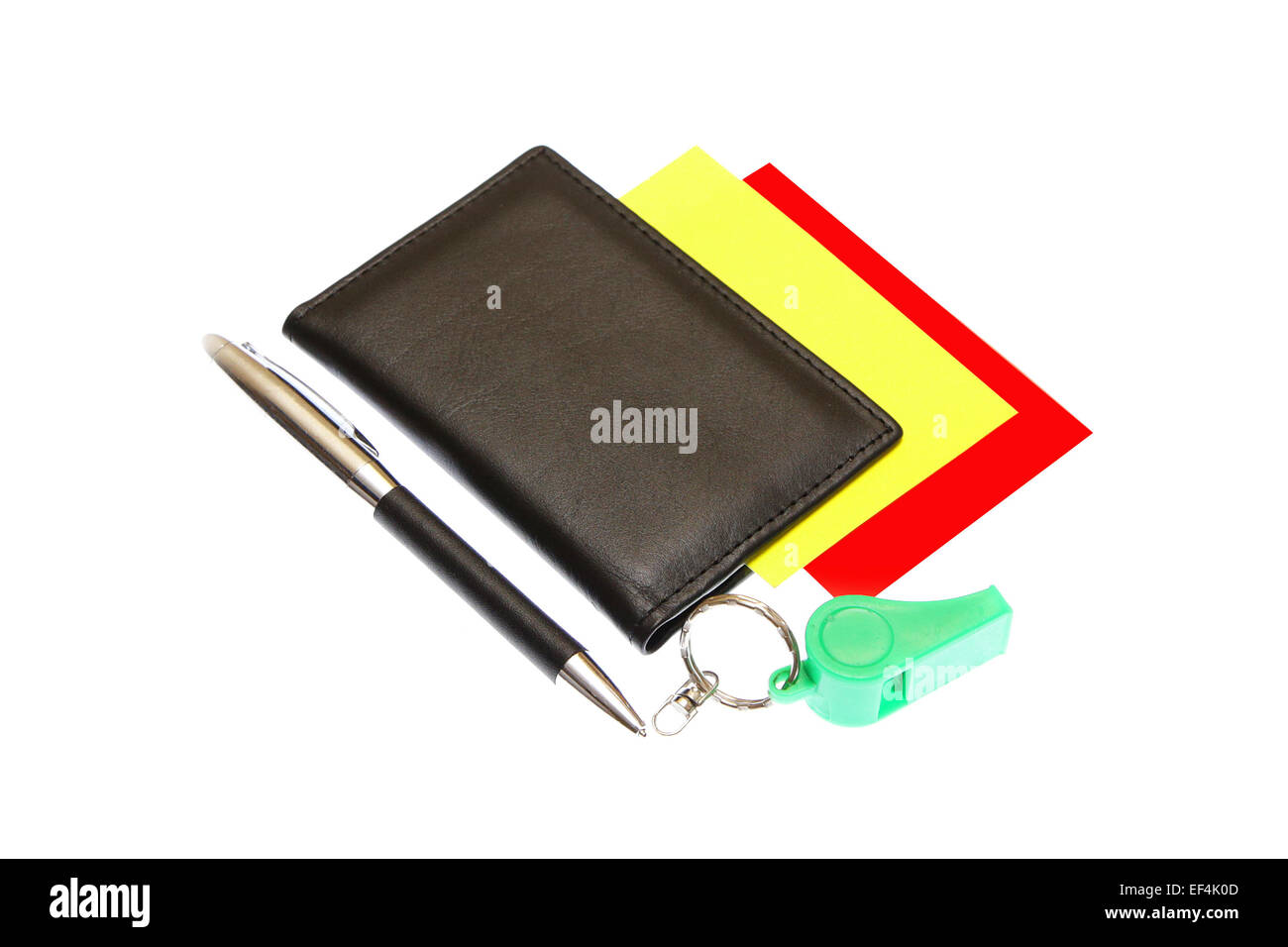 green plastic whistle and red card on white background Stock Photo