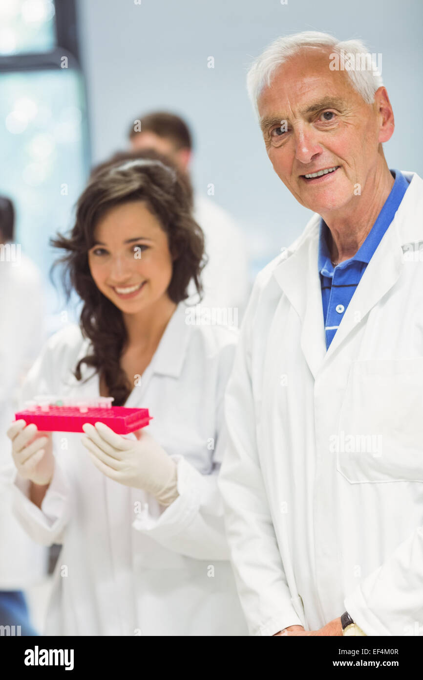 Lecturer and student smiling at camera in the lab Stock Photo