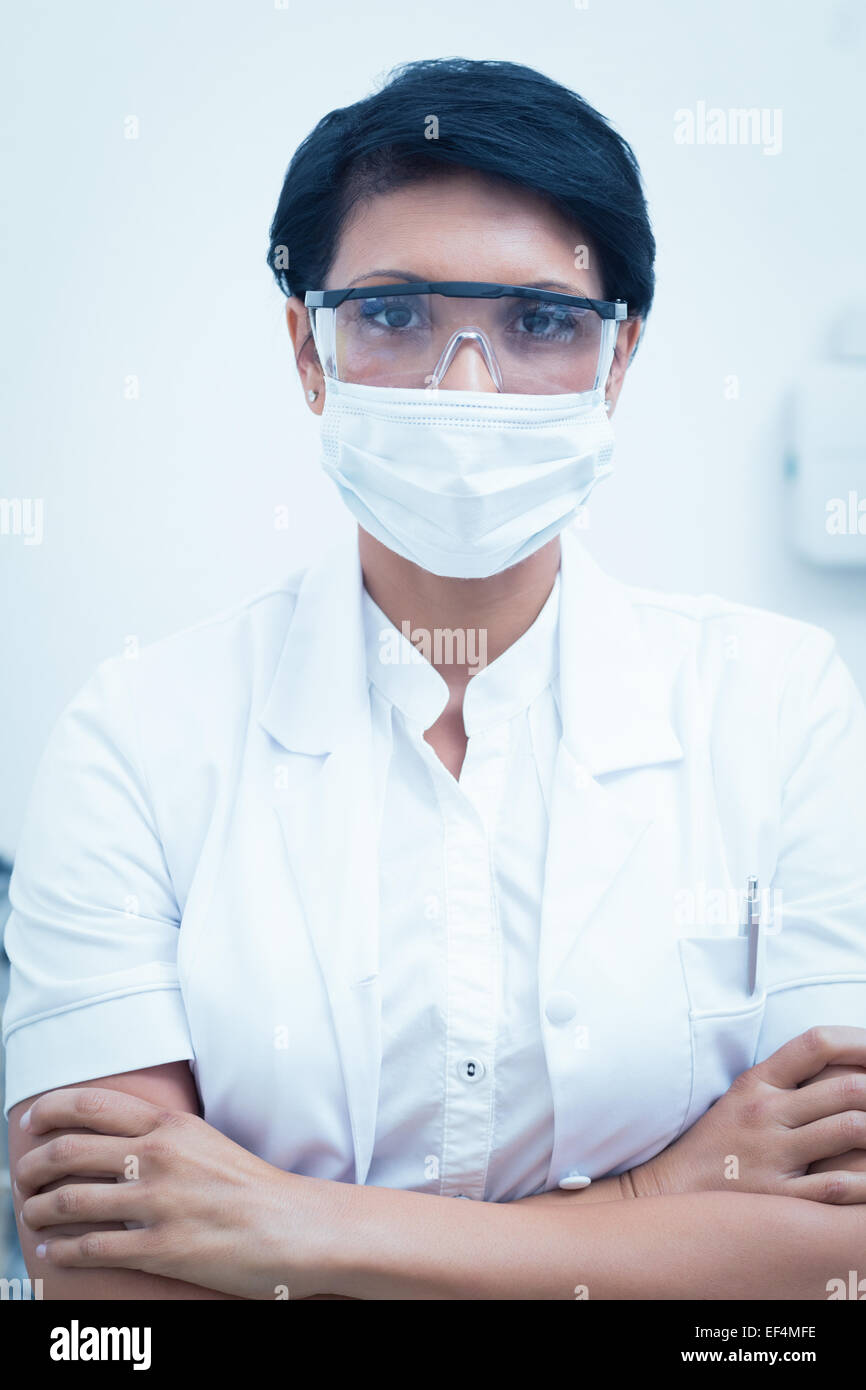 Dentist wearing surgical mask and safety glasses Stock Photo - Alamy