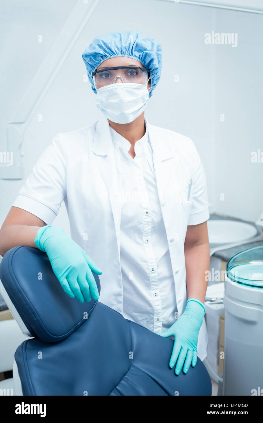 Dentist wearing surgical mask and safety glasses Stock Photo - Alamy