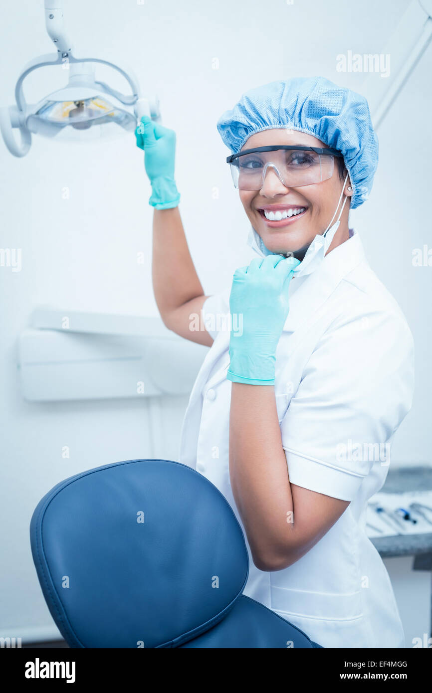 Female dentist wearing surgical cap and safety glasses Stock Photo Alamy