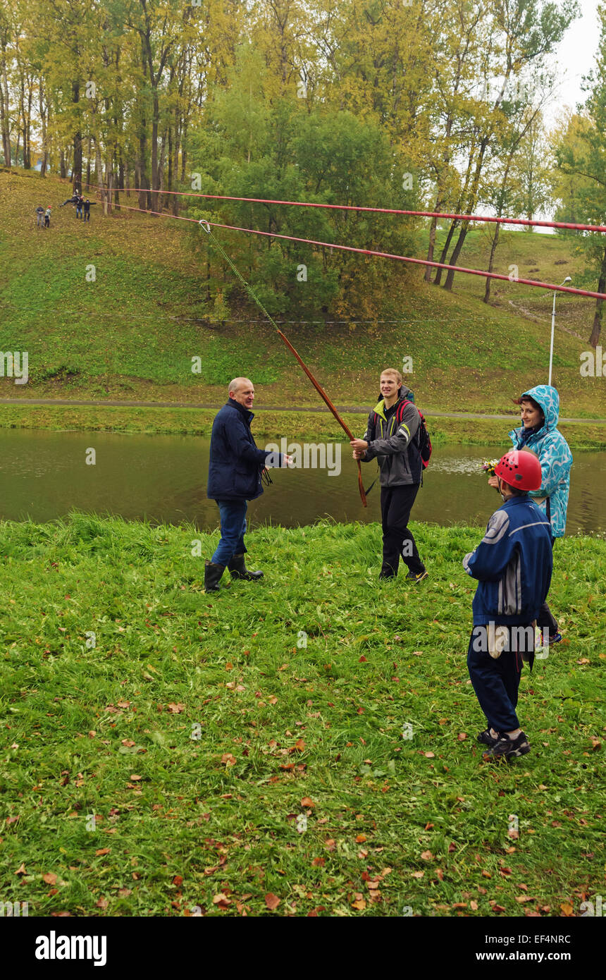 World Tourism Day - sport tourism competition in park on the river Vitba, Vitebsk, inclined crossing on ropes through the river. Stock Photo