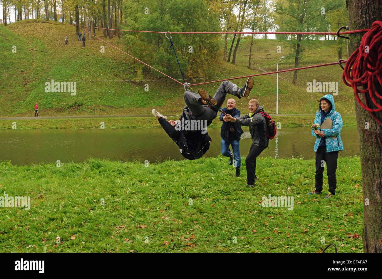 World Tourism Day - sport tourism competition in park on the river Vitba, Vitebsk, inclined crossing on ropes through the river. Stock Photo