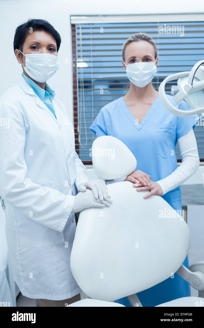 Female dentists wearing surgical masks Stock Photo Alamy