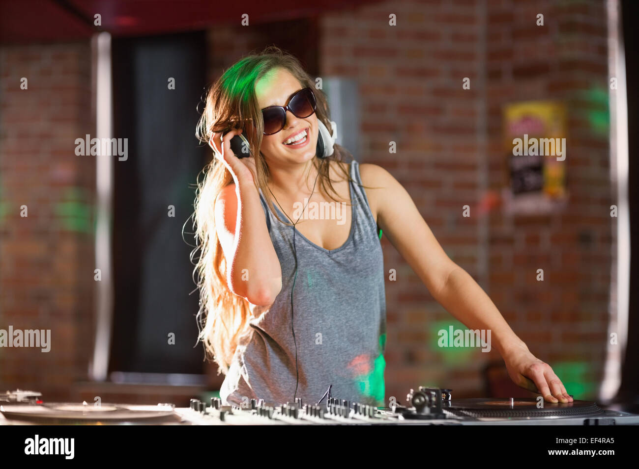 Pretty dj playing techno music Stock Photo