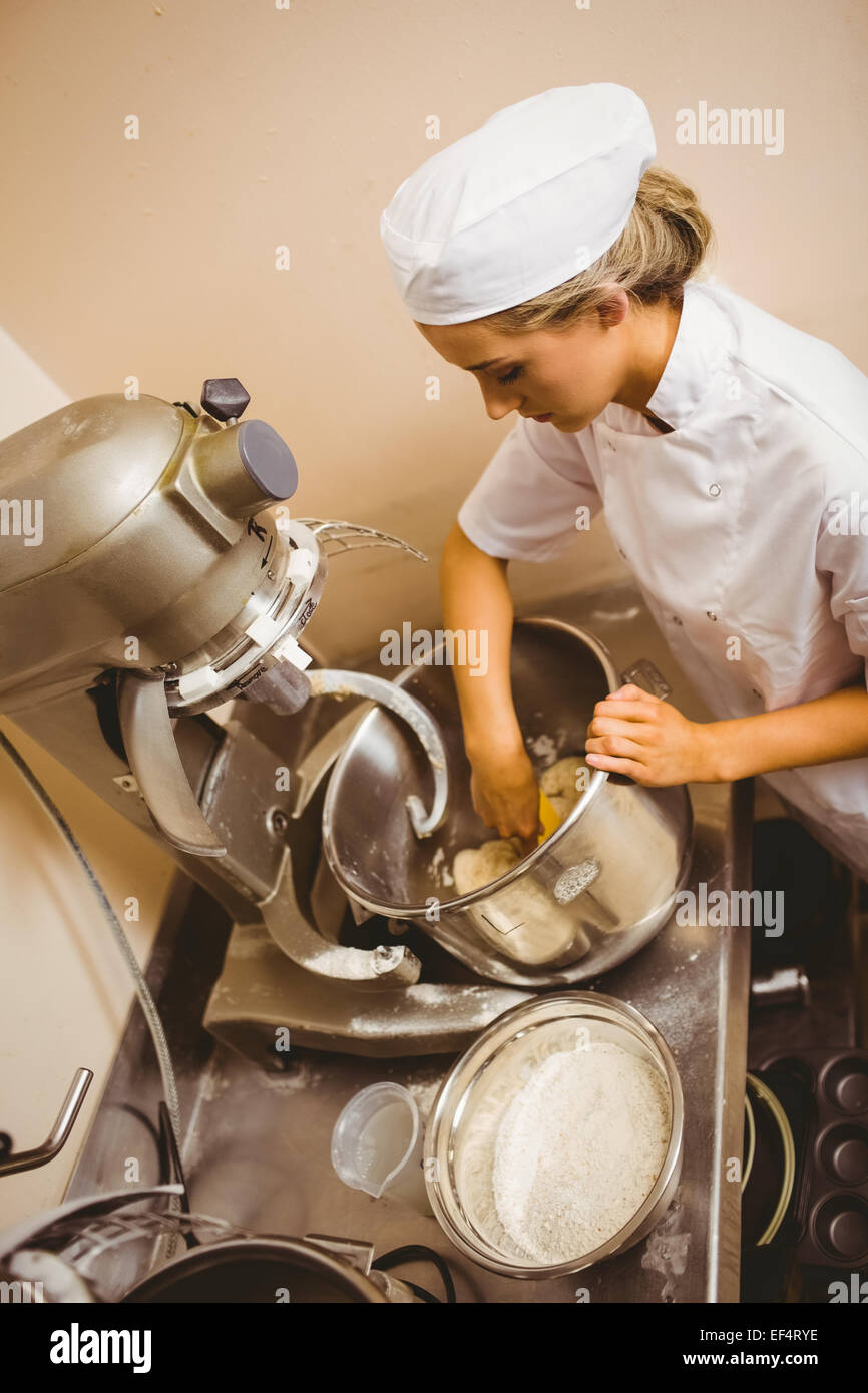 Bread Mixer In Bakery, mixing dough for baguettes in a bakery machine for  mixing dough Stock Photo - Alamy