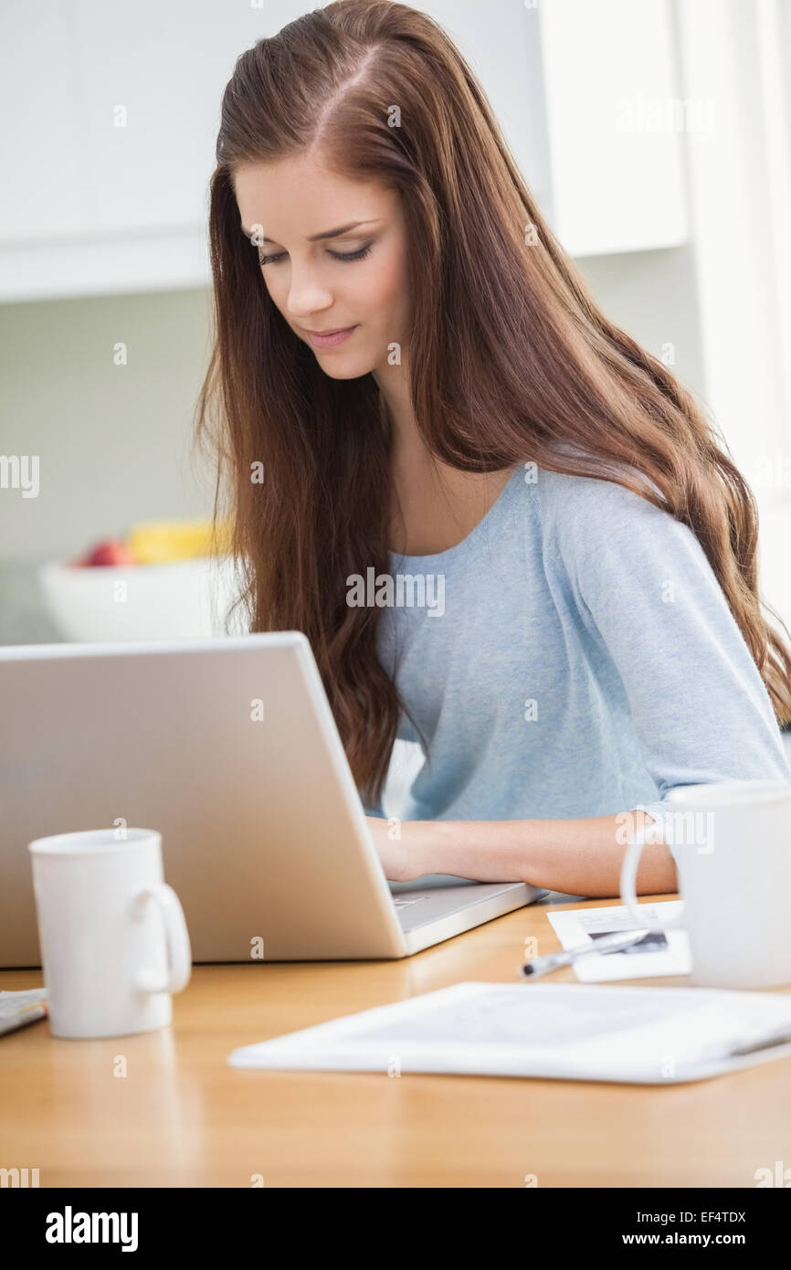 Pretty young girl using laptop Stock Photo - Alamy