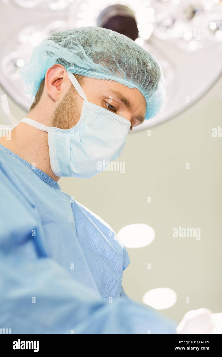 Young surgeon wearing mask and cap Stock Photo - Alamy