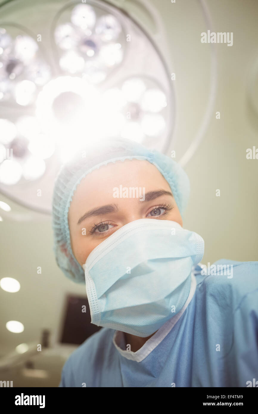 Young surgeon looking down at camera Stock Photo - Alamy