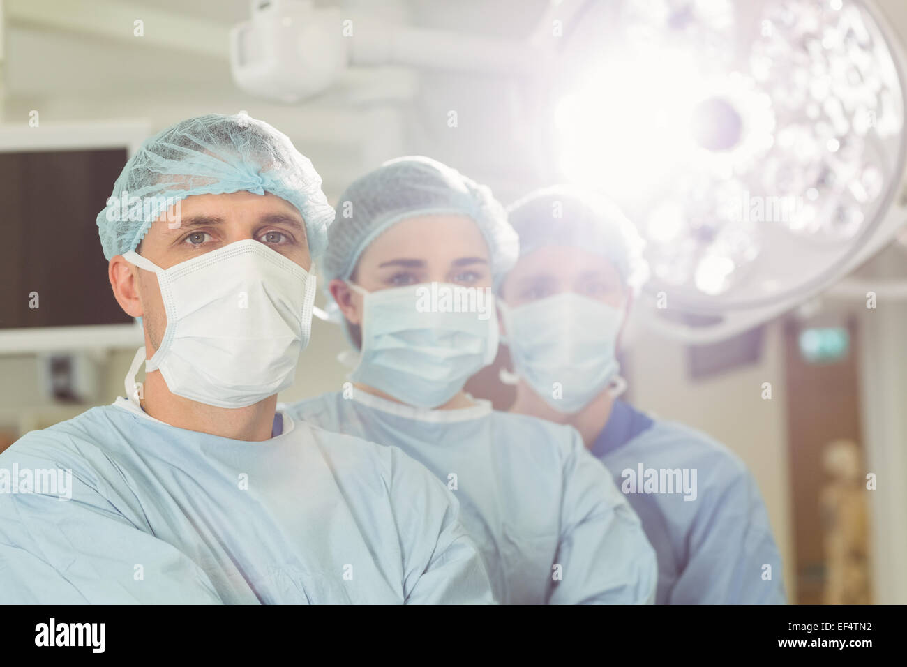 Team of surgeons looking at camera Stock Photo - Alamy