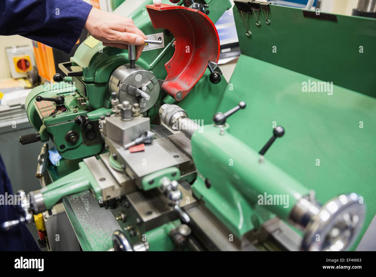 Engineering student using heavy machinery Stock Photo