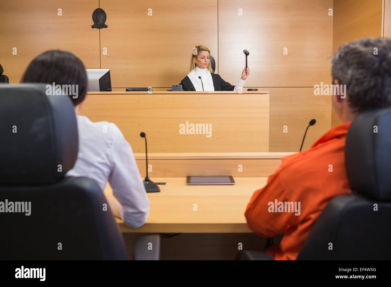 Lawyer and client listening to judge Stock Photo