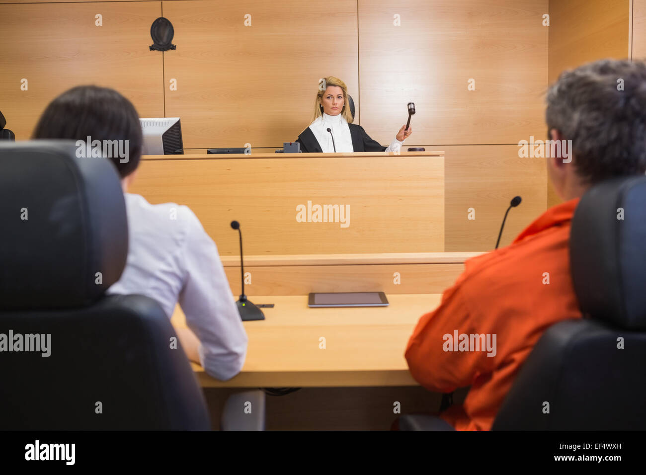 Lawyer and client listening to judge Stock Photo
