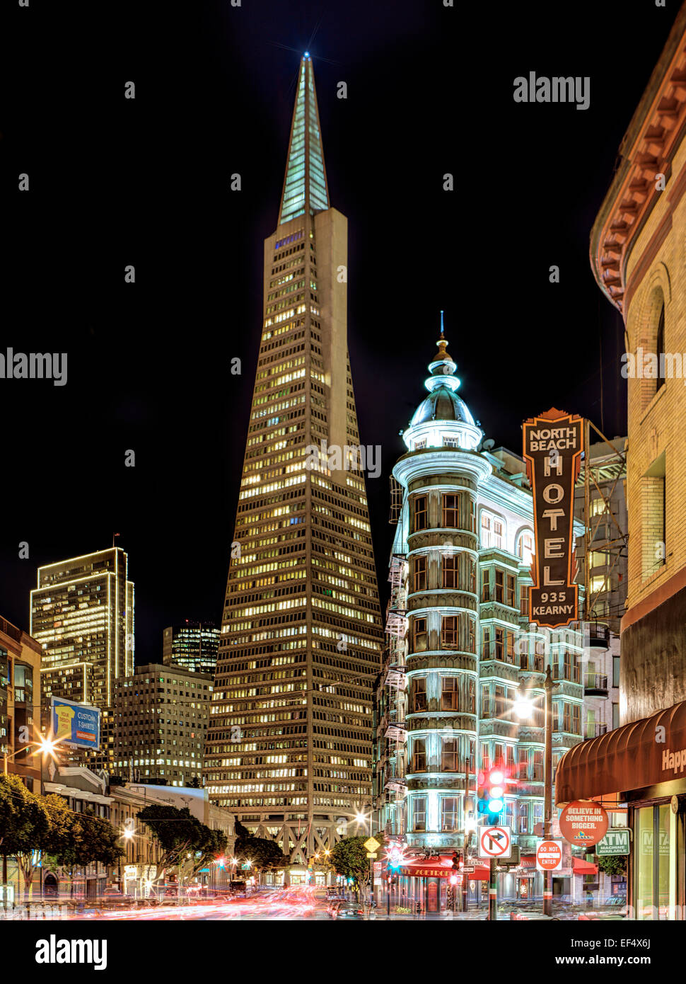 The Trans America pyramid and Coppola building on Columbus San Francisco at night Stock Photo