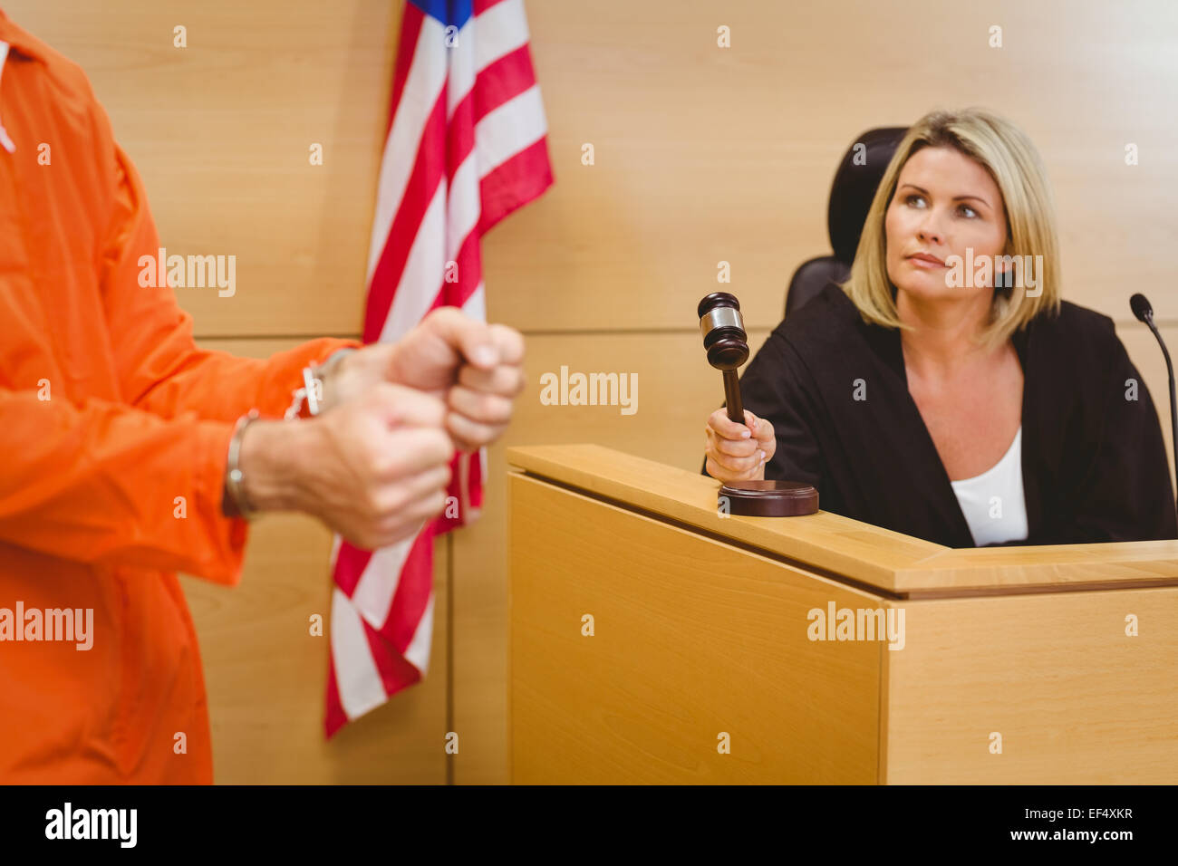 Judge about to bang gavel on sounding block Stock Photo