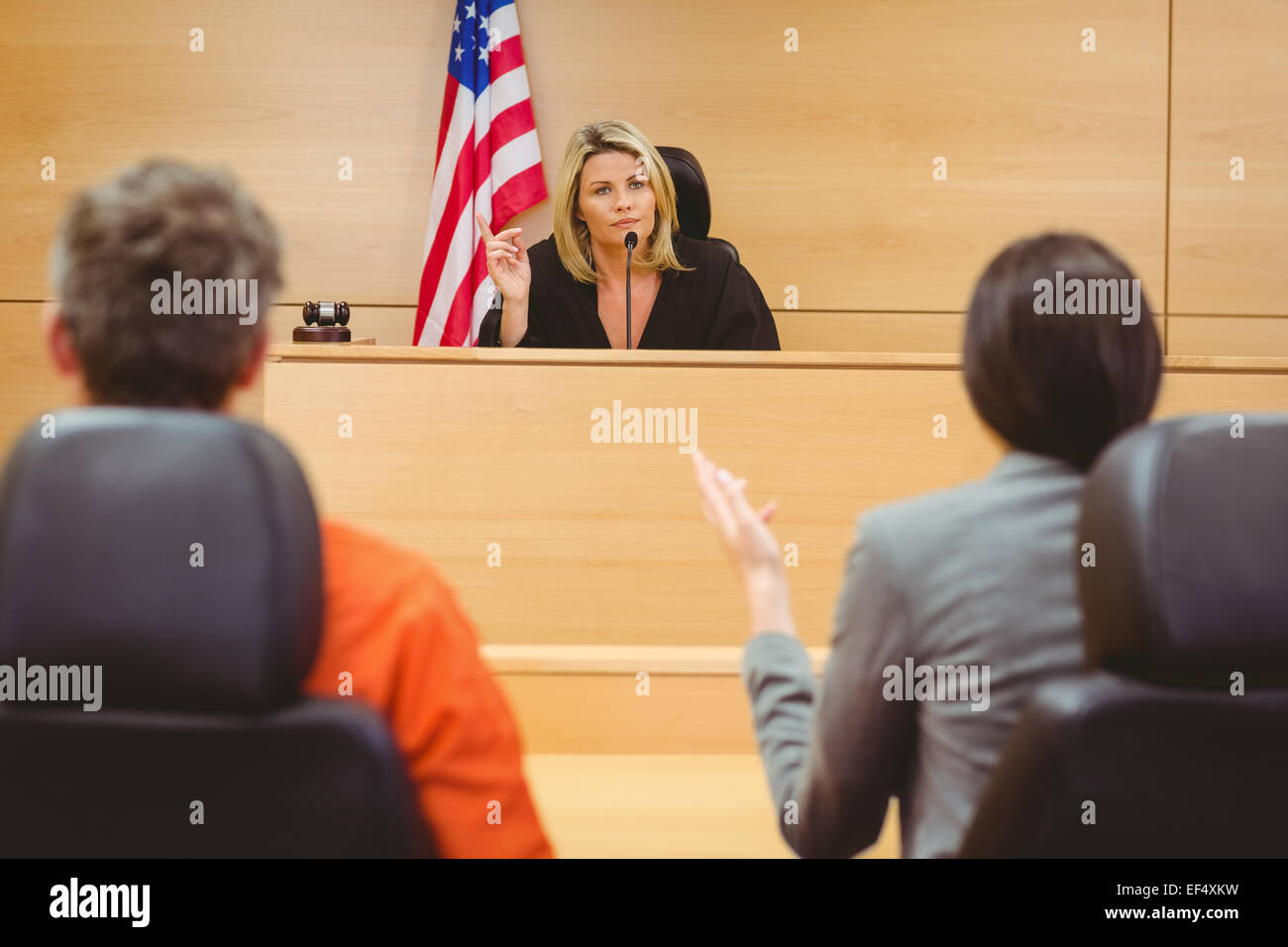 Judge and lawyer discussing the sentence for prisoner Stock Photo