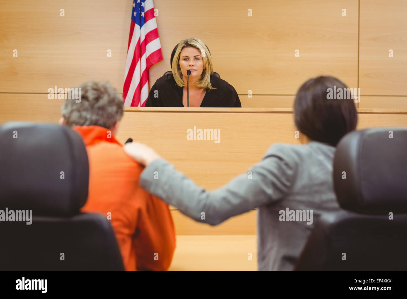 Judge and lawyer discussing the sentence for prisoner Stock Photo