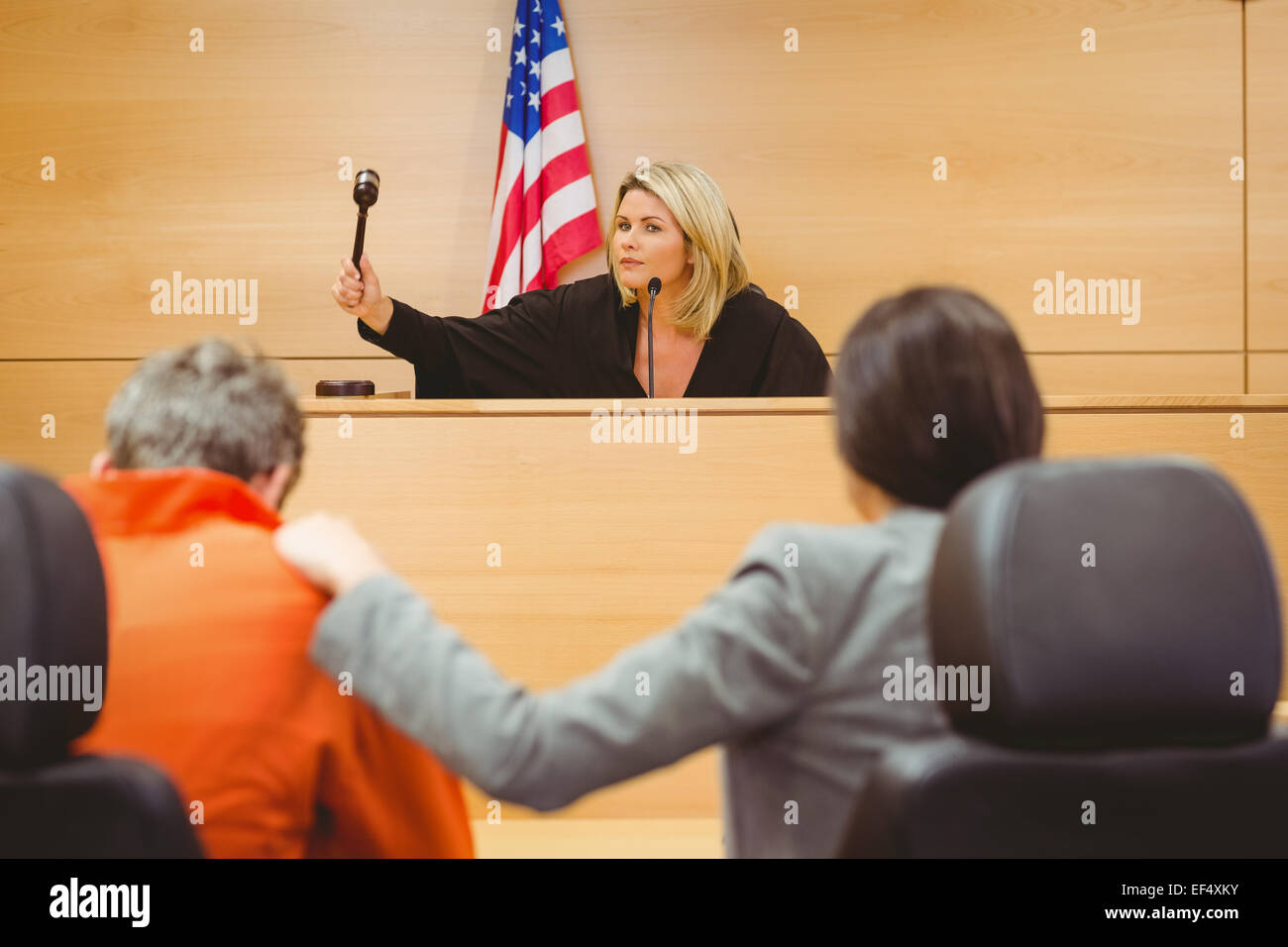 Judge about to bang gavel on sounding block Stock Photo