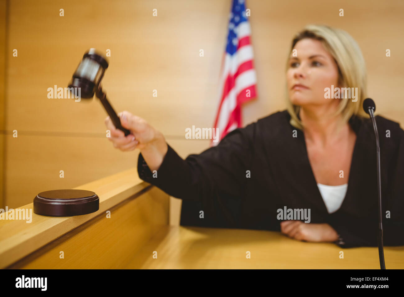 Judge about to bang gavel on sounding block Stock Photo Alamy