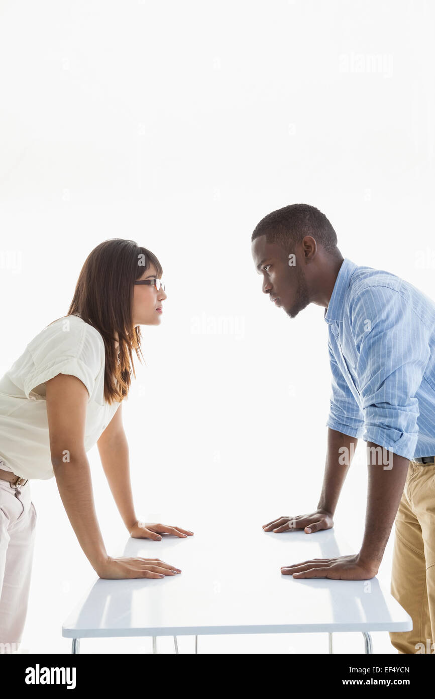 Business people having a stand off at their desk Stock Photo