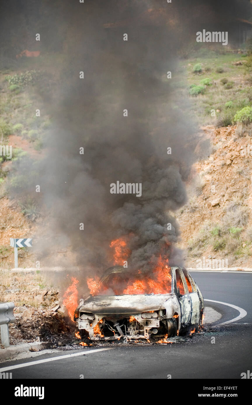 car fire fires engine flame flames up in smoke intense heat leaping insurance burning burn raging fireball toxic on third party Stock Photo