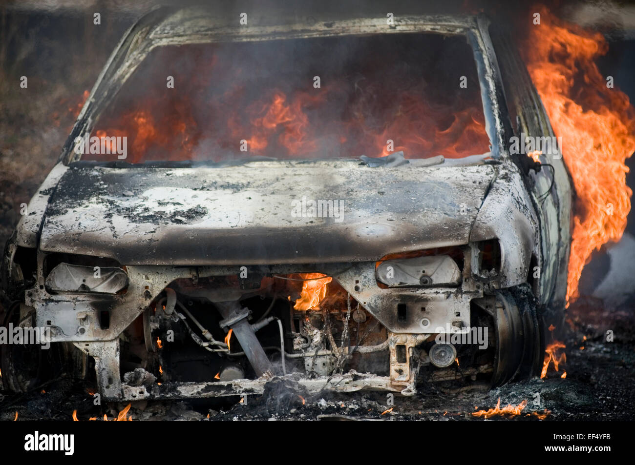 car fire fires engine flame flames up in smoke intense heat leaping insurance burning burn raging fireball toxic on third party Stock Photo