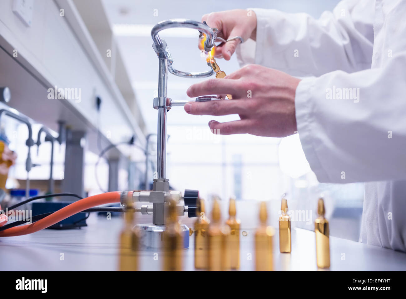 Close up of a biochemist sealing a vial Stock Photo