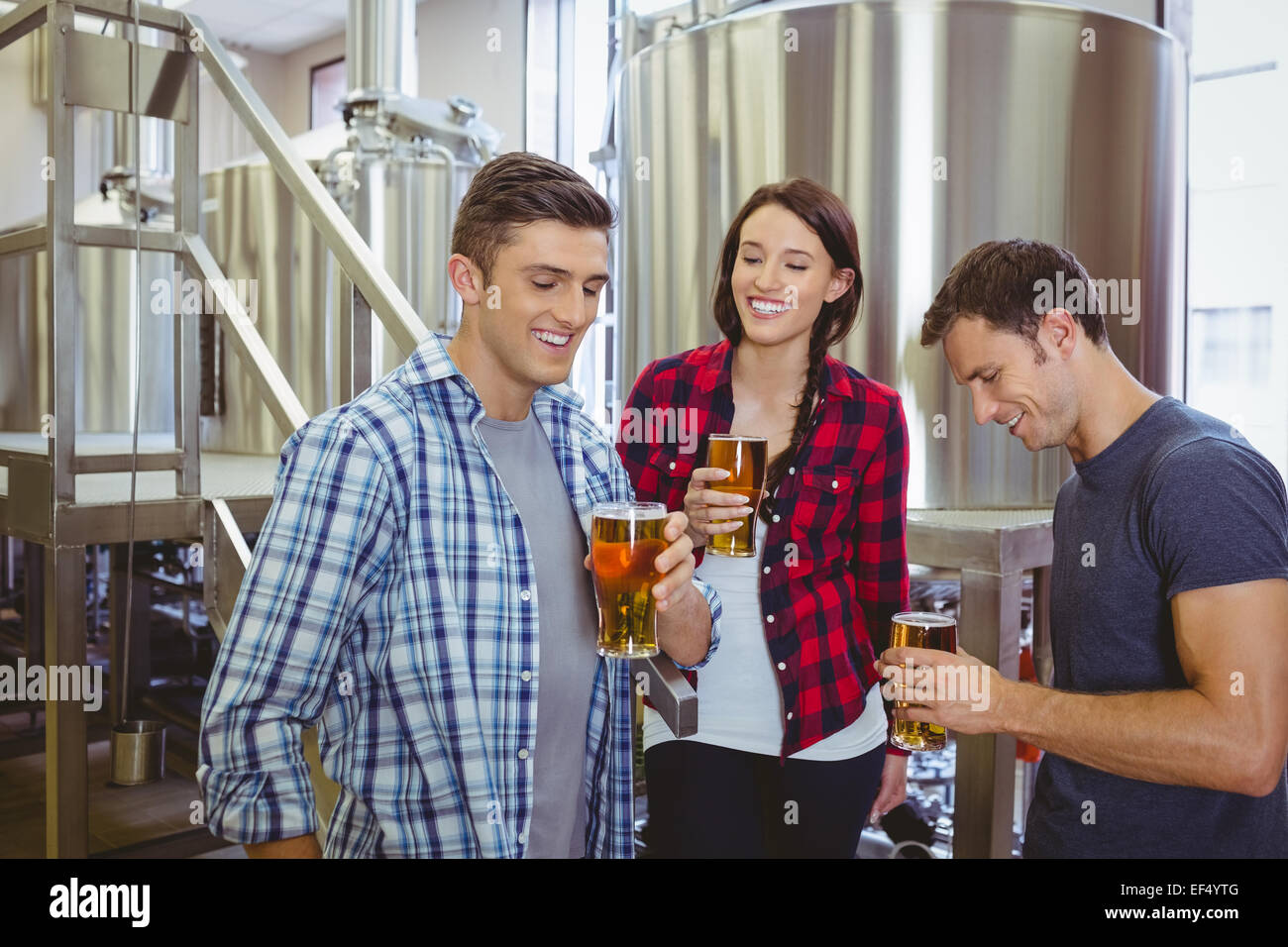 Young hipsters tasting beer together Stock Photo