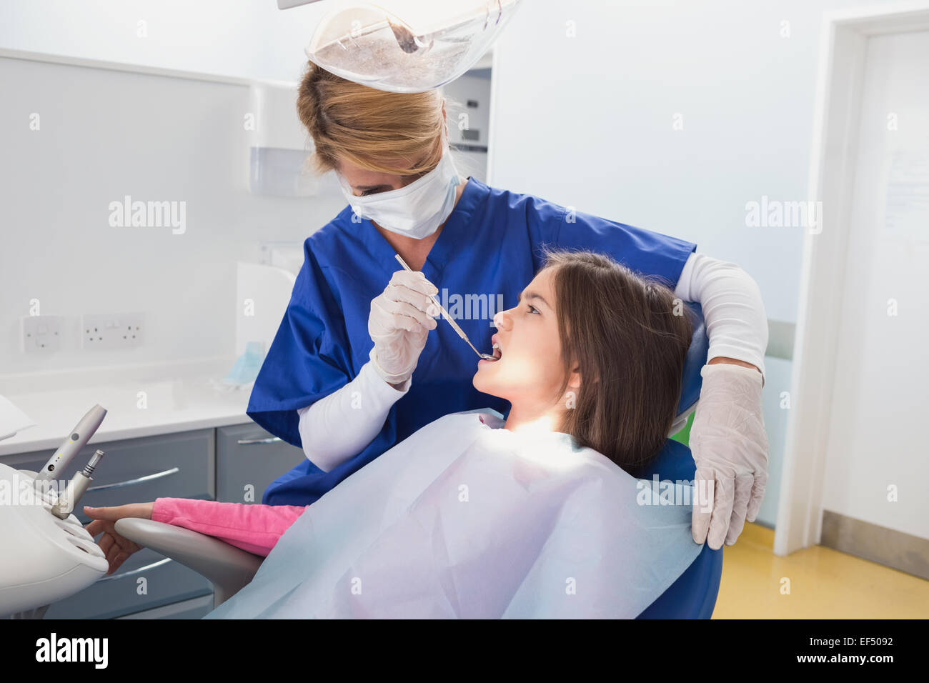 Pediatric dentist examining her young patient Stock Photo