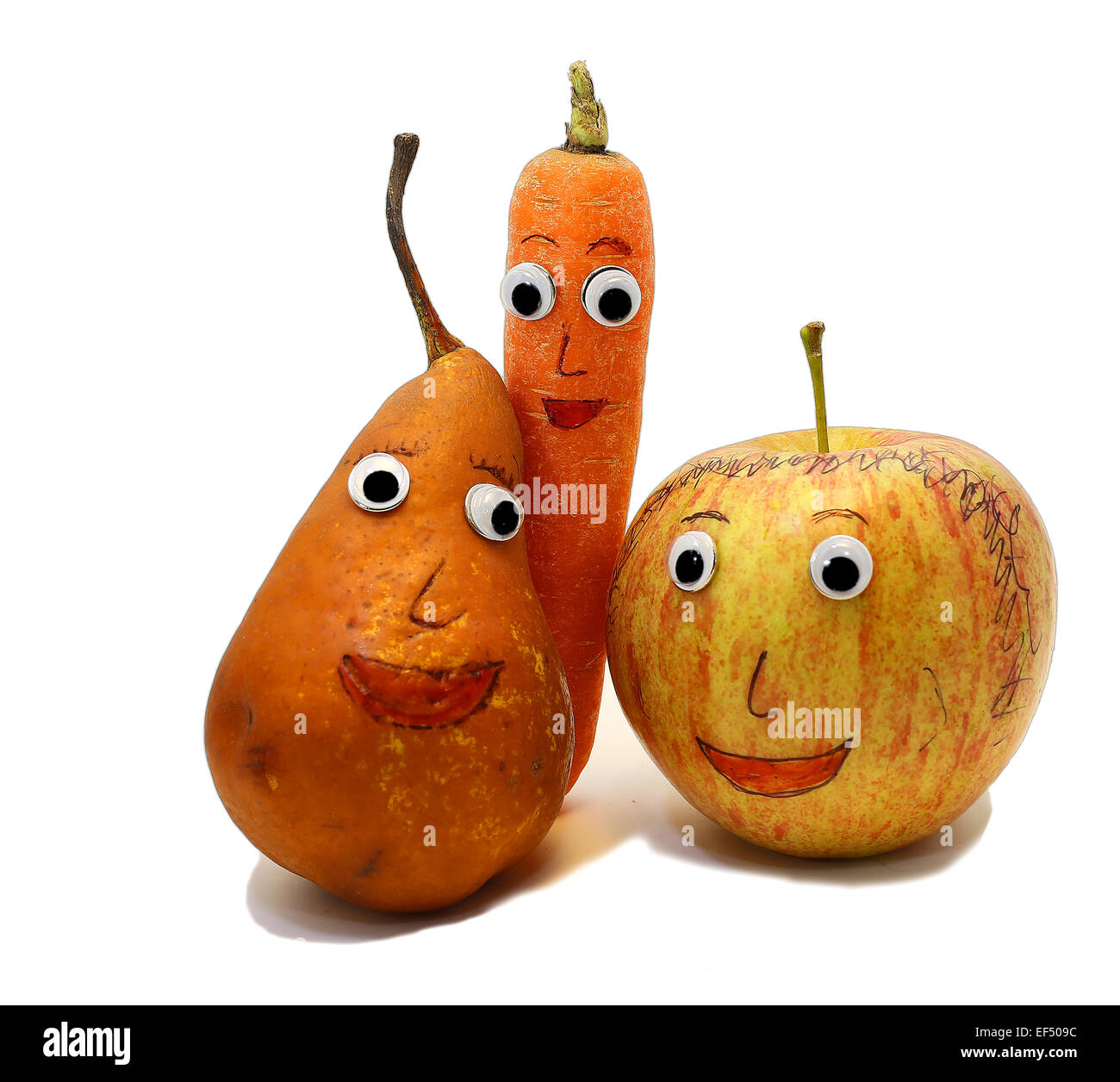 PEAR and carrot and one apple with very big eyes Stock Photo