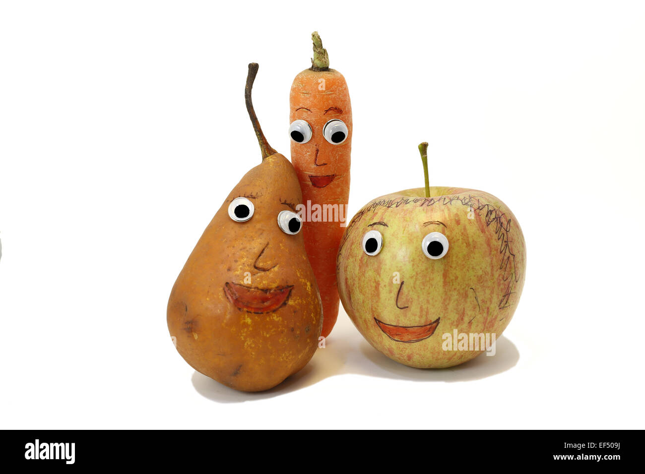 PEAR and carrot and one apple with big eyes Stock Photo