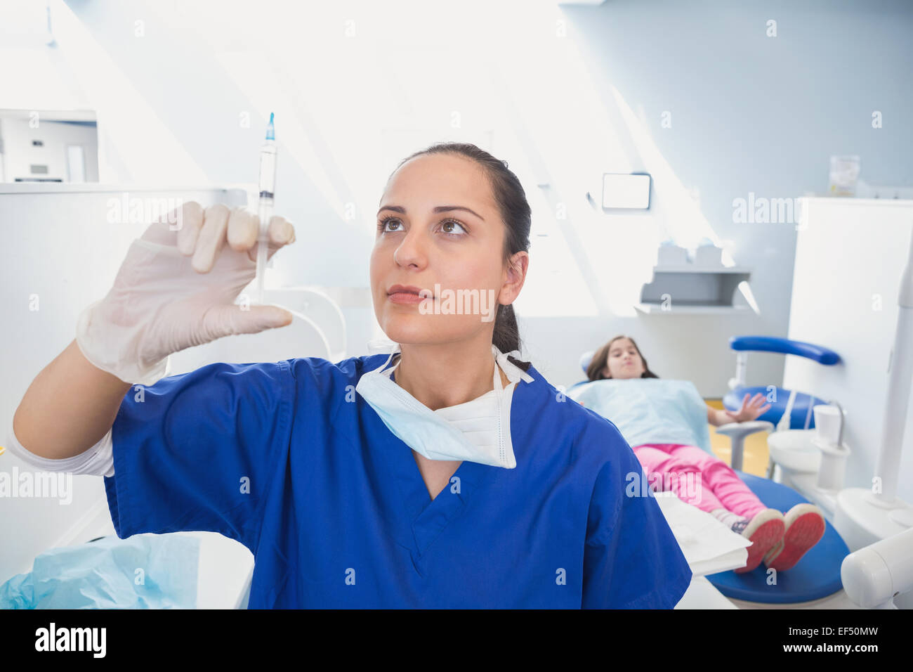 Pediatric dentist preparing an injection Stock Photo